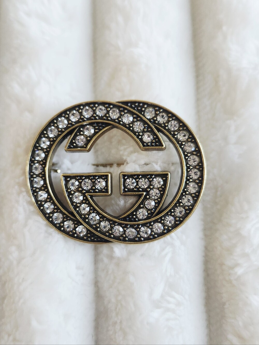 Gucci Interlocking GG Logo Brooch Aged Gold Tone Crystal Pave